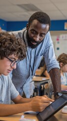 Obraz premium Engaged Teacher Assisting Student with Tablet in Classroom Setting