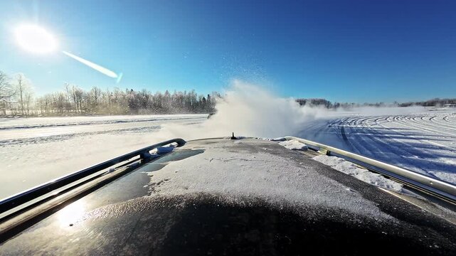 Cars deliberately skidding in the snow for fun