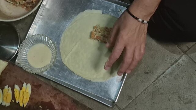 Risol ragout is a savory snack containing stir-fried chicken/meat and vegetables (carrots/potatoes) cooked with bechamel sauce (a mixture of butter, flour, and milk) until thick and creamy.