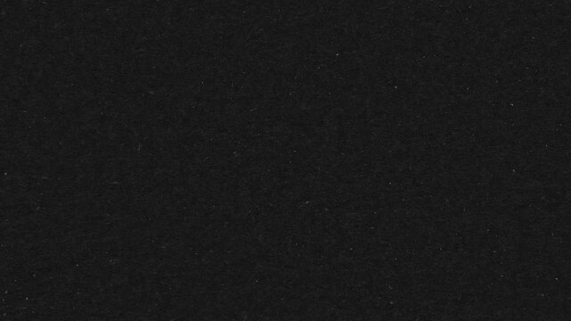 Grunge Paper Stop Motion.Scratches and dust dark grunge paper background. Loop. 4K animated video.