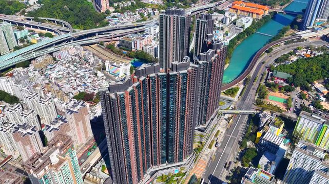 Tai Wai Station residential development in Hong Kong New Territories aerial view of high rise housing built over railway hub connecting to urban city centers solving shortages 