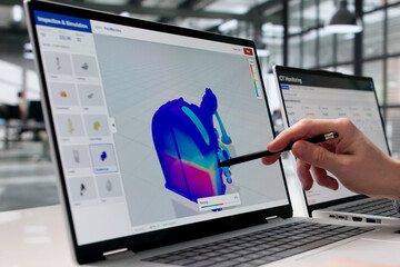 Mechanical Engineer Examines 3D Stress Simulation Data