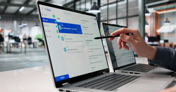 Young Professional Reviewing Emails On Laptop