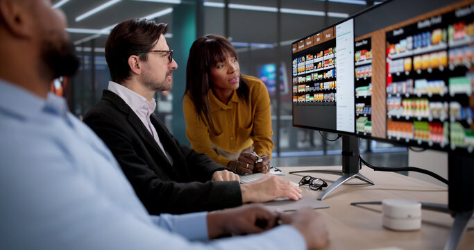 Diverse Team Collaborates On Store Shelf Layout, Planning