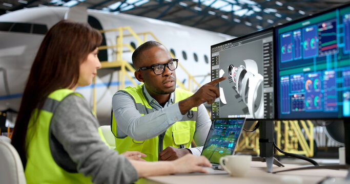 Technicians Inspect Jet Engine Parts