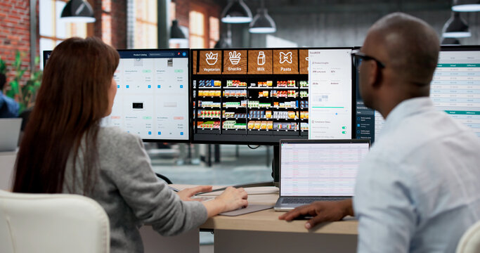 Young Store Manager Analyzes Supermarket Shelf Layout On Computer Screen
