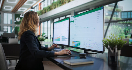 Dedicated Environmental Lawyer Woman Analyzing ESG Report © Andrey Popov