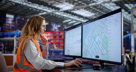 Efficient Woman Managing Multiple Desktop Computers