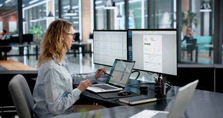 Accountant Creating Invoices On Monitor In Medical Office Using Computer