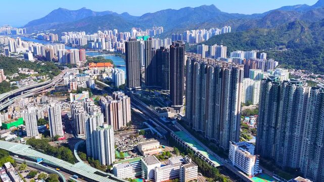 Tai Wai Station residential development in Hong Kong New Territories aerial view of high rise housing built over railway hub connecting to urban city centers solving shortages 