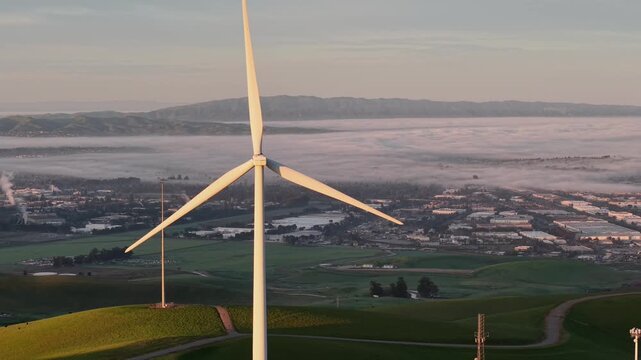 wind turbines in the mountains with low fog as the background, Livermore, California, USA