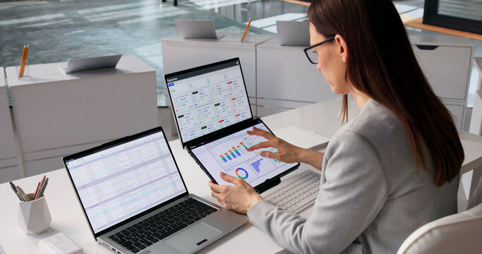 Fintech Specialist Examines Various Financial Dashboards And Reports
