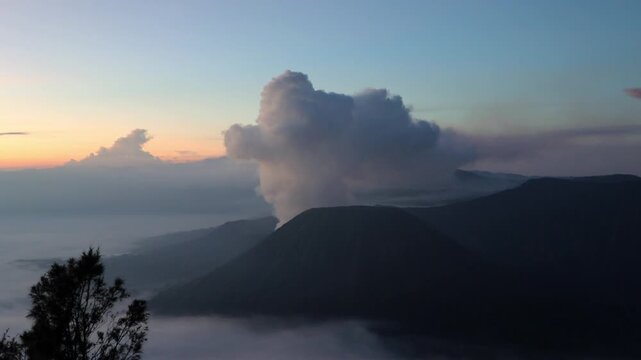 Gunung Batok Cinder Cone with Mount Bromo Eruption at Sunrise | King Kong Hill, East Java, Indonesia