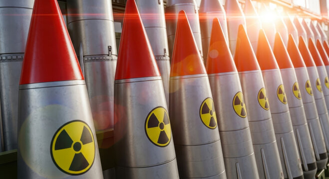 A repeating line of metallic intercontinental ballistic missiles standing tall with red cone tips and large radioactive hazard symbols