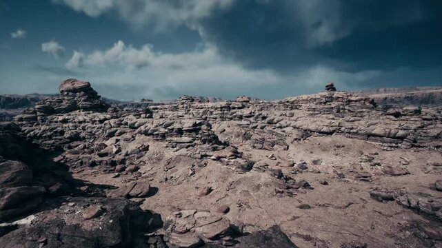 wide barren landscape with layered ridges, rusttoned sandstone and scattered stones create mars analogue simulation for rover testing and field research