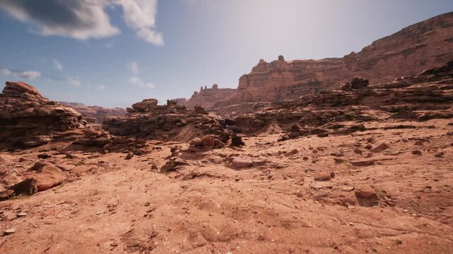Open desert scrubland with rocky outcrops and scattered stones, warm midday light, rough ground suitable for offroad adventure staging and basecamp planning