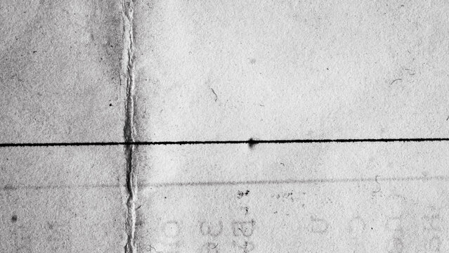 Distressed paper texture with cross lines, ink marks and scan artifacts on real page surface. Analog macro paper background.