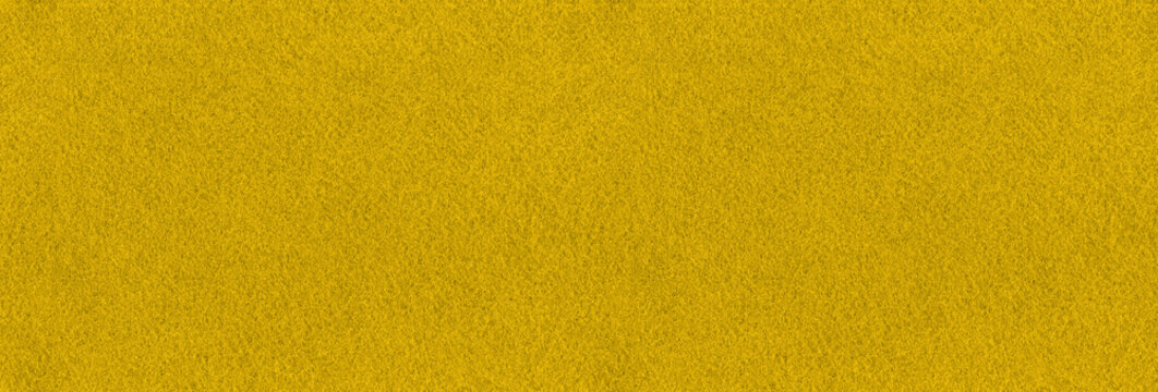 Yellow fabric texture background. Seamless golden cloth interior design pattern. Solid yellow color light backdrop.