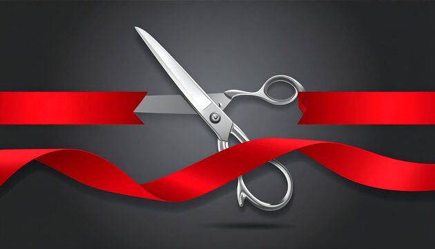 A pair of silver scissors cutting through a flowing red ribbon