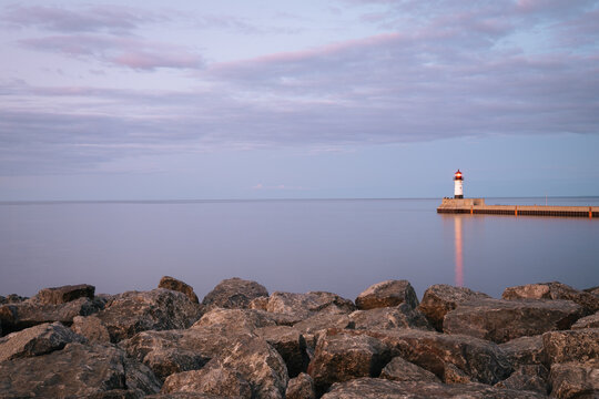 North Pier Lighthouse at dusk seen from the shoreline of Lake Superior in Duluth, Minnesota