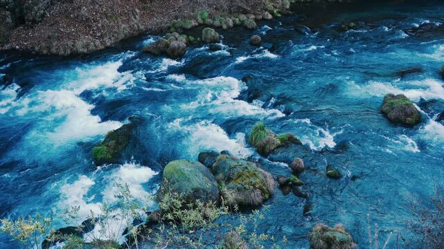 Vibrant Blue Water Surface of Flowing Daiya River in Nikko, Japan