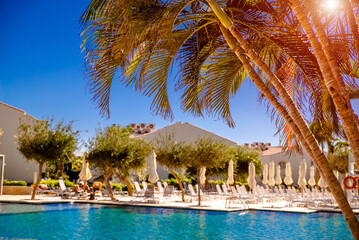 Obraz premium Sun loungers are located by the pool in the hotel 