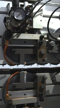Automated Extrusion System Creating White Strips On Guided Rail In Welllit Industrial Environment. Media