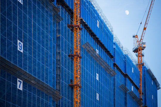 Construction Cranes Blue Scaffolding Skyscraper Moon