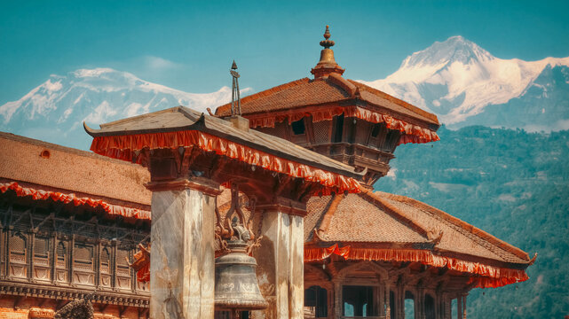 Ancient Patan Durbar Square Temple and Taleju Bell with Snowy Himalayas with copy space