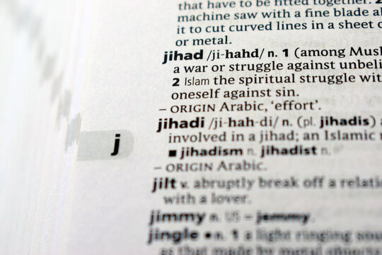 Close Up English Dictionary Page With The Word Translation Of - jihad