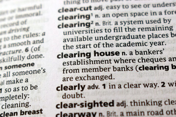 Fototapeta premium English Dictionary Page Close Up With The Word Definition Of - clearing house