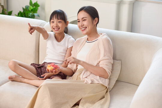 Mum hanging out with her daughter at home