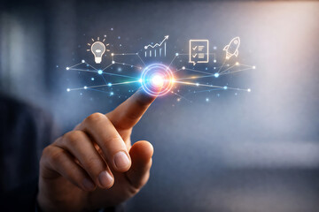 Obraz premium Businessman touching digital interface with business icons