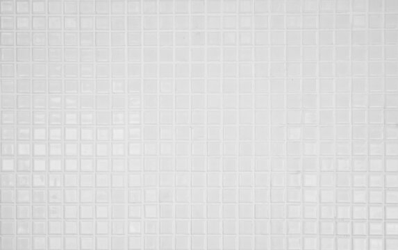 White tile brick wall background bathroom texture. Ceramic brick wall and floor tiles mosaic background in bathroom and kitchen clean. Design pattern geometric with grid wallpaper decoration.