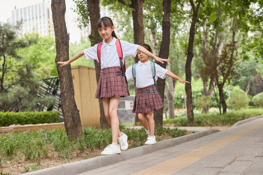 Two happy girls after school