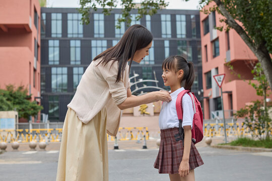 Mum taking her daughter to school