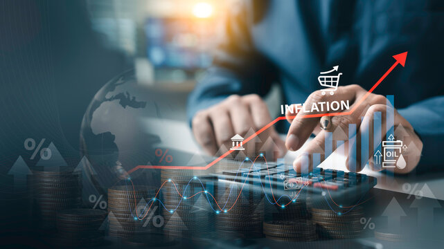 Inflation concept, Businessman using calculator with rising inflation graph and coins. economic crisis, high cost of living, financial recession, price increase affect global stock market investment.