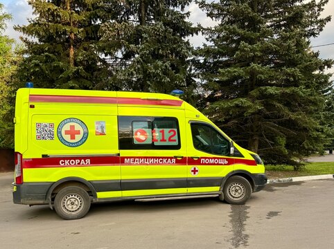 Russia, Moscow region, Krasnogorsk. May 20, 2025. An ambulance parked on the street in summer