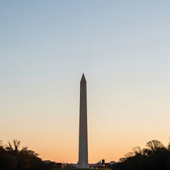 A towering obelisk stands tall against a gradient sky, with trees lining the foreground