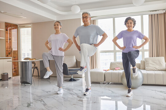 Seniors doing home exercises to stay active