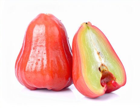 Two vibrant red wax apples on a white background, one whole and one halved, revealing a pale, spongy interior with a single seed. Fresh, crisp, and ready to eat.