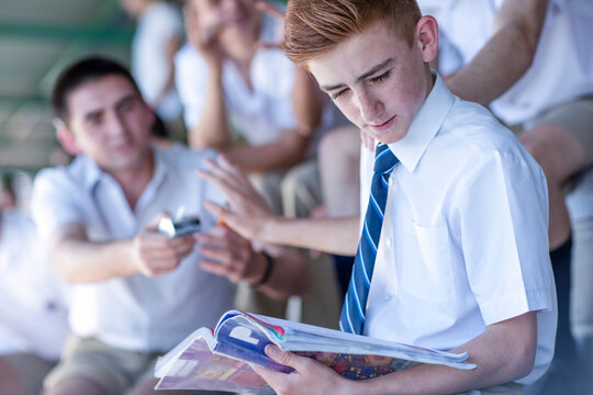 High school student denying to take a cigarette from classmate
