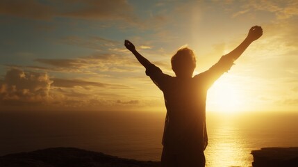 Fototapeta premium Person with raised arms feeling joy and success overlooking the ocean at sunset with copy space