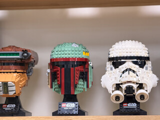 Naklejka premium Lego star wars helmet models on shelf