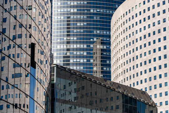 Paris La Defense financial district cityscape with modern glass skyscraper office architecture showing layered towers for corporate growth themes