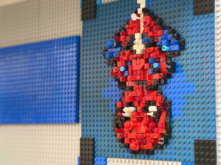 Naklejka premium Red and blue lego mosaic on baseplate