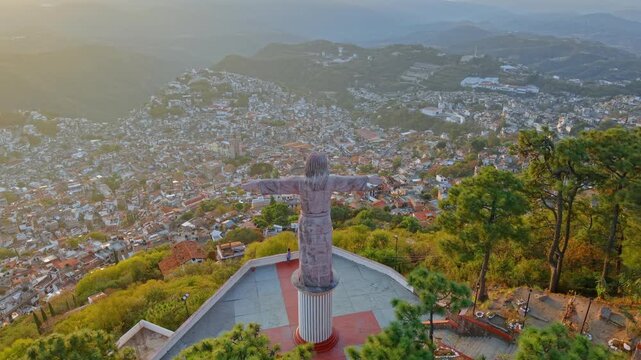 Static aerial view from the Monumental Christ of Taxco watching over and observing the town of Taxco on a sunny day, Guerrero, Mexico