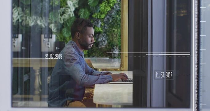 Man at table typing on laptop and pausing with sliding timeline overlays tracking business dates