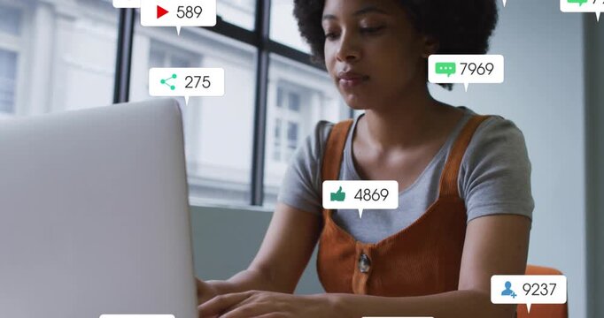 Woman typing on laptop starting alert bubbles growing and drifting over screen as tracking stats