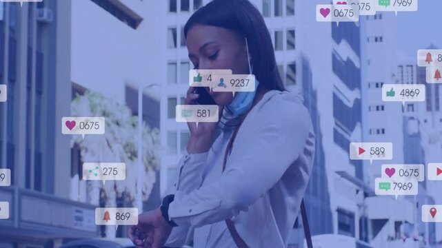 Woman talking on phone checking watch while monitoring feed phone getting marketing icons over city